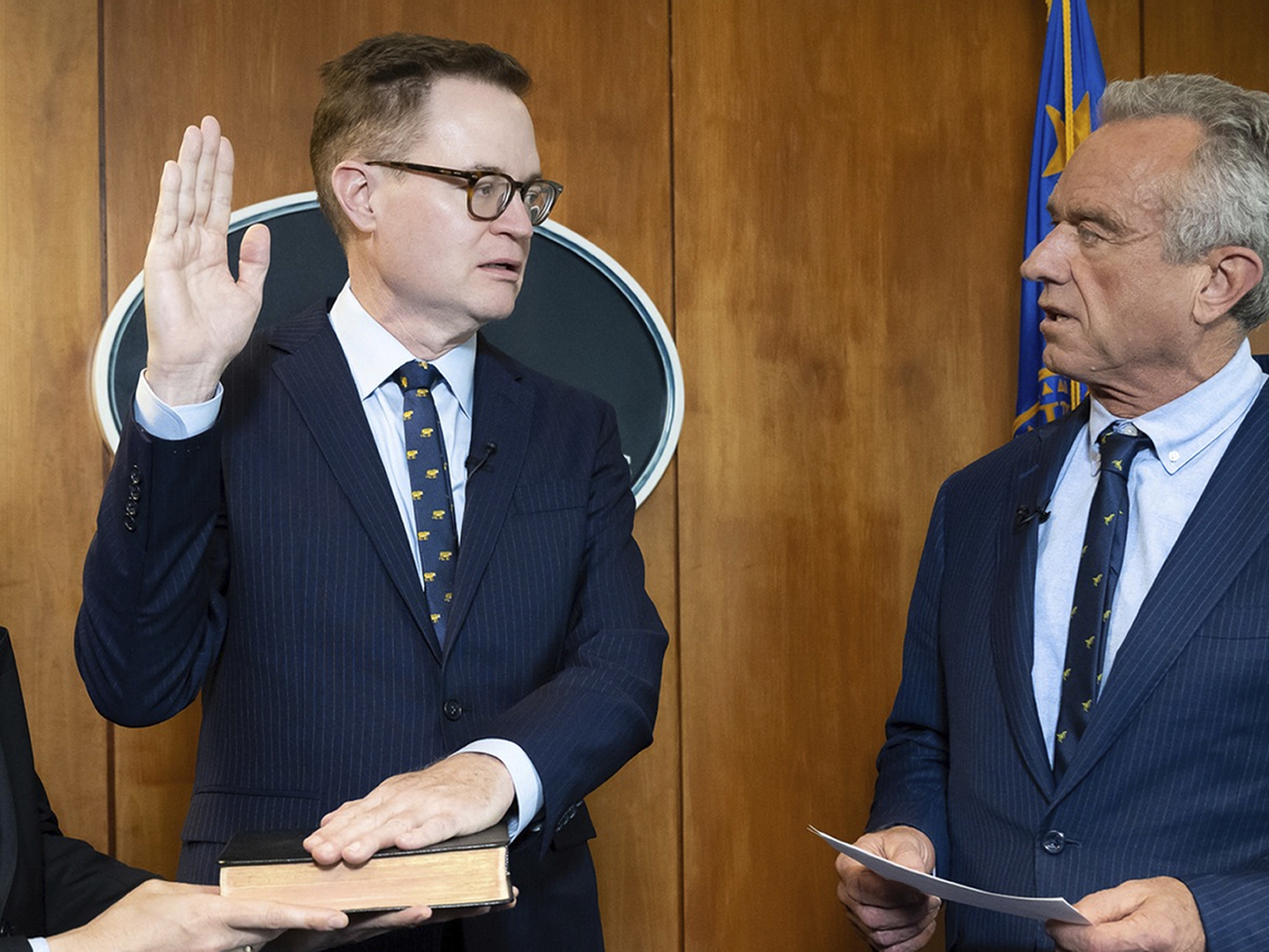 caption: Jim O'Neill is the new acting director of the CDC. Here, HHS Secretary Robert F. Kennedy Jr. swears him in as deputy secretary of HHS on June 9. O'Neill will serve in both roles.