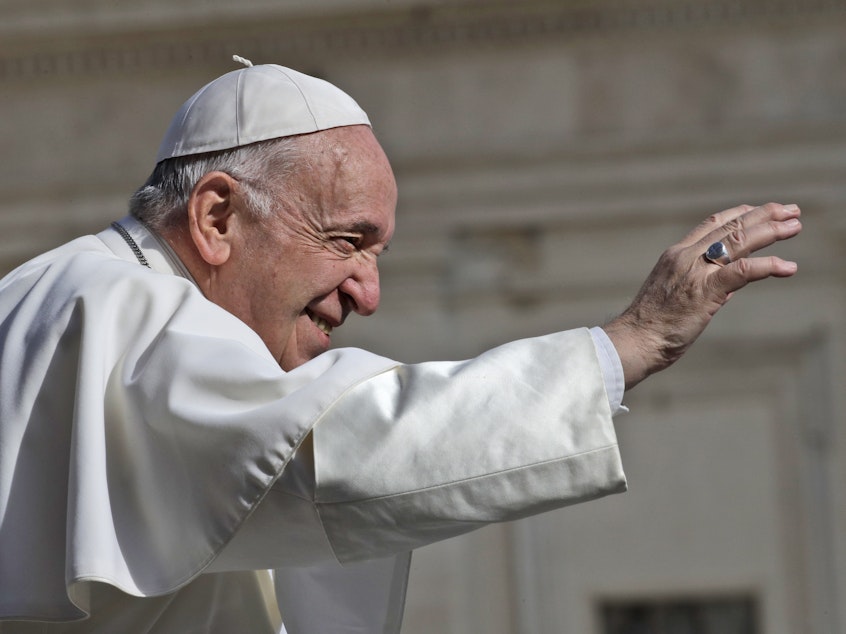caption: Pope Francis arrives for his weekly general audience on Wednesday in St. Peter's Square at the Vatican.