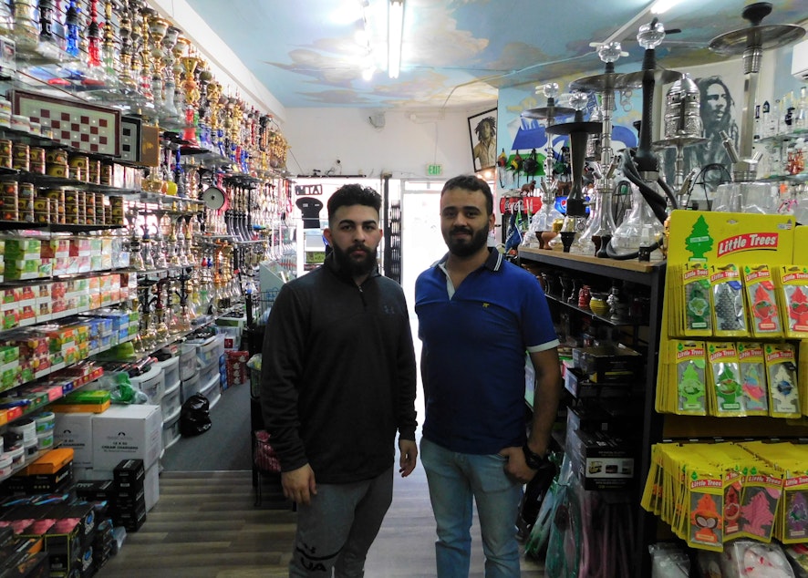 caption: Store Manager Ali P. and Shop Owner Yasir Shammar