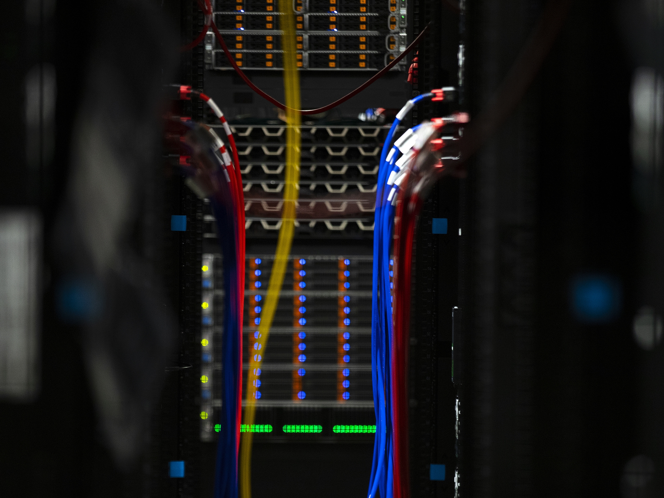 caption: Cables are shown inside a server bank at the Sabey data center on Thursday, July 17, 2025, in Quincy, Washington.
