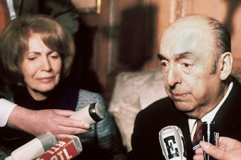 caption: Chilean writer, poet and diplomat Pablo Neruda answers journalists' questions in 1971.