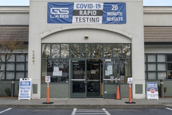 caption: GS Labs Covid-19 Testing Clinic in a closed down restaurant building in Vancouver, Washington, on March 28, 2022. 