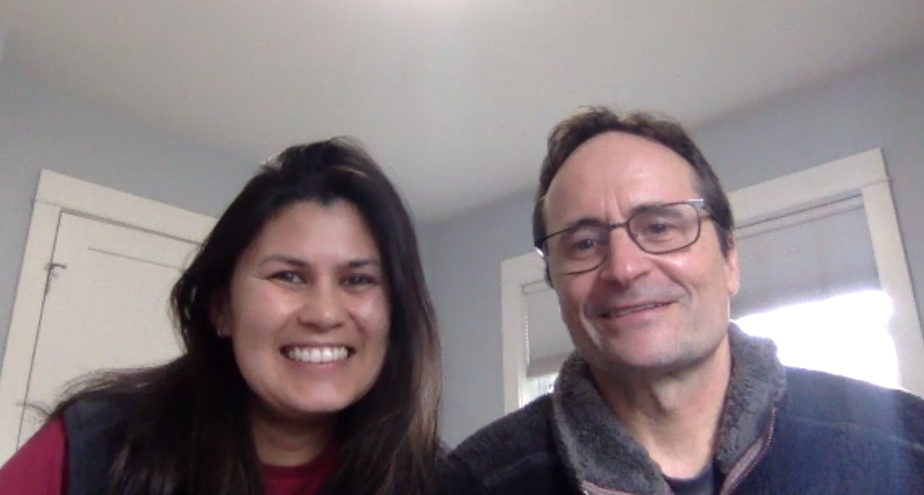 caption: Jim Mazza and Lizz Dexter-Mazza, at home and seen through their webcam. The two hold free, daily online classes for kids and parents on how to cope during Covid-19