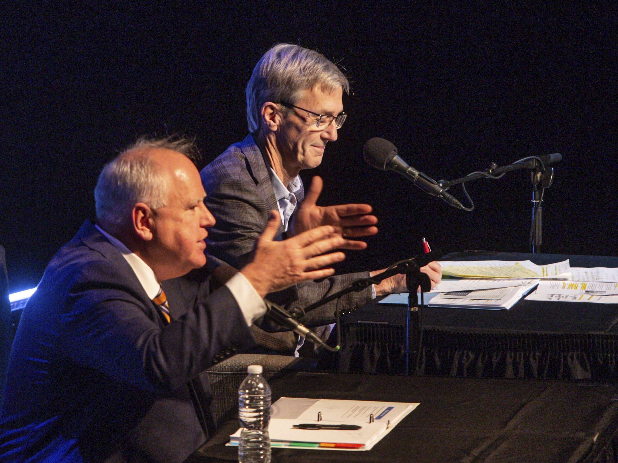 caption: Minnesota Gov. Tim Walz (left) and gubernatorial candidate Scott Jensen engage in a gubernatorial debate at the Fitzgerald Theater on Oct. 28, 2022, in St. Paul.<br>