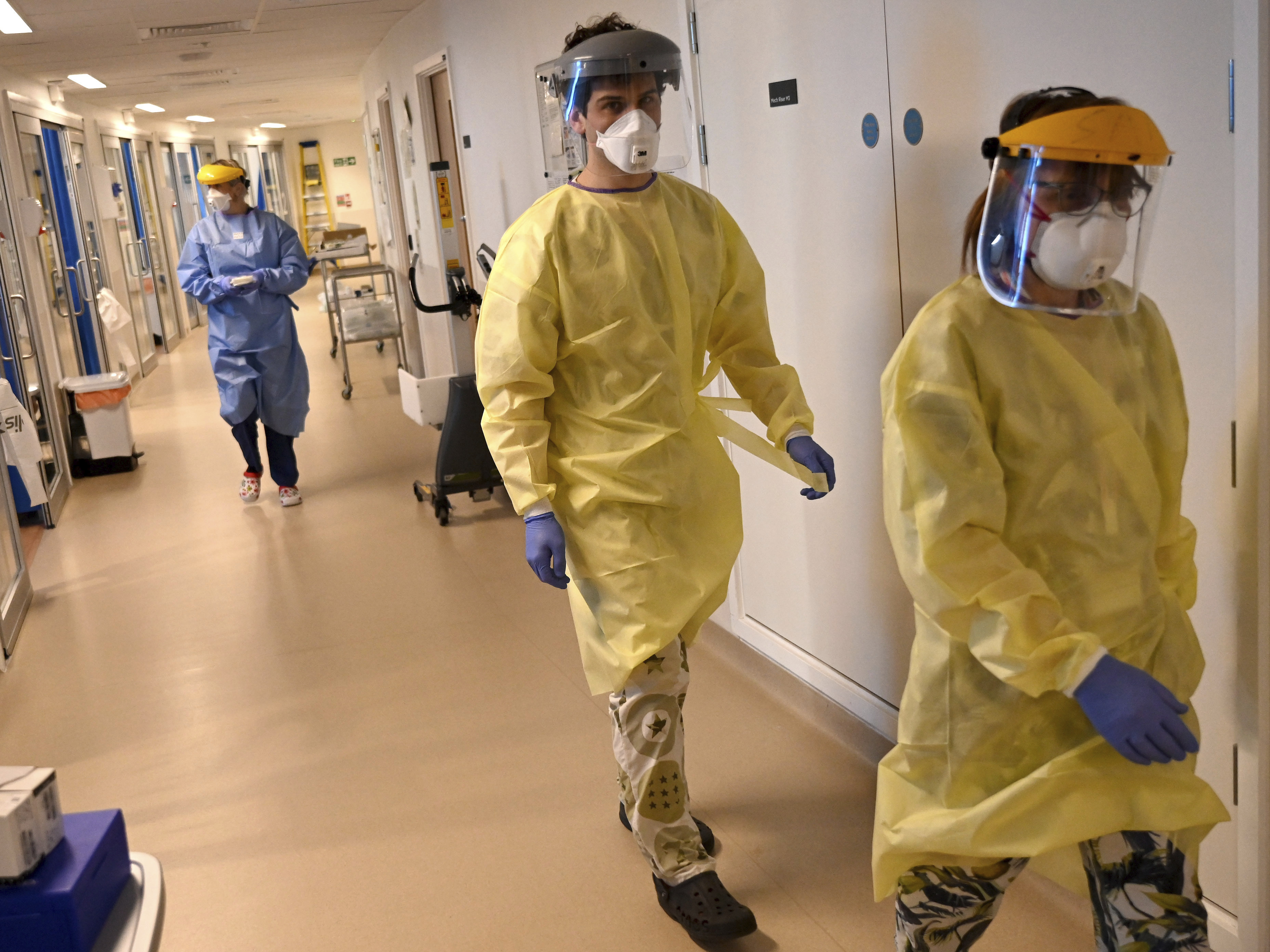 caption: Coronavirus deaths in the U.K. have passed those in Italy. Workers in the intensive care unit at the Royal Papworth Hospital in Cambridge are shown gearing up to care for COVID-19 patients.