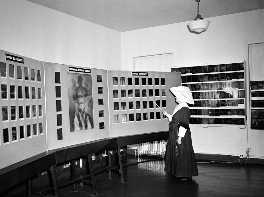 caption: Decades ago, people with leprosy were confined to a hospital in Carville, La. The fear of being forcibly isolated in this place led many patients to avoid seeking treatment and hide their disease. In the 1950s, the Daughters of Charity worked at the hospital and the research lab it housed.