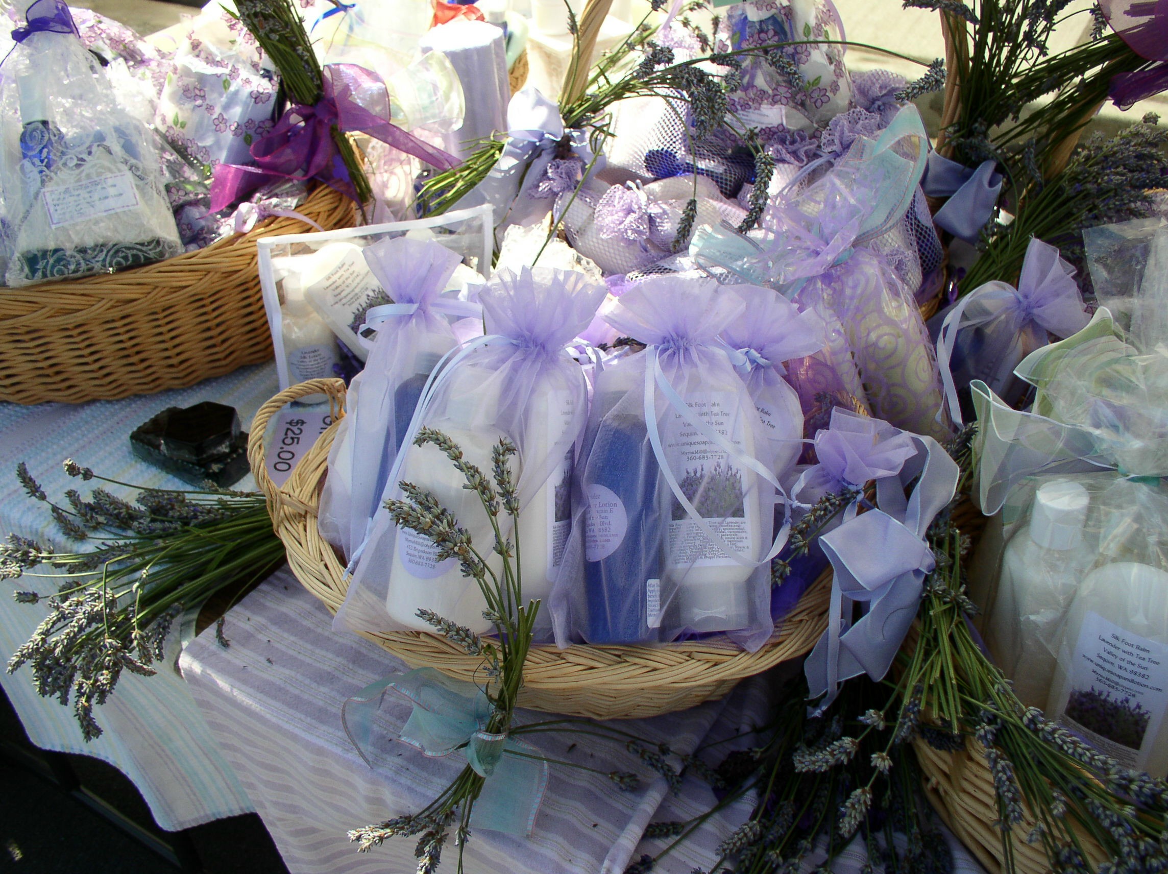 caption: Sheryl Wiser surveys lavender offerings at the wonderful smelling Sequim market.