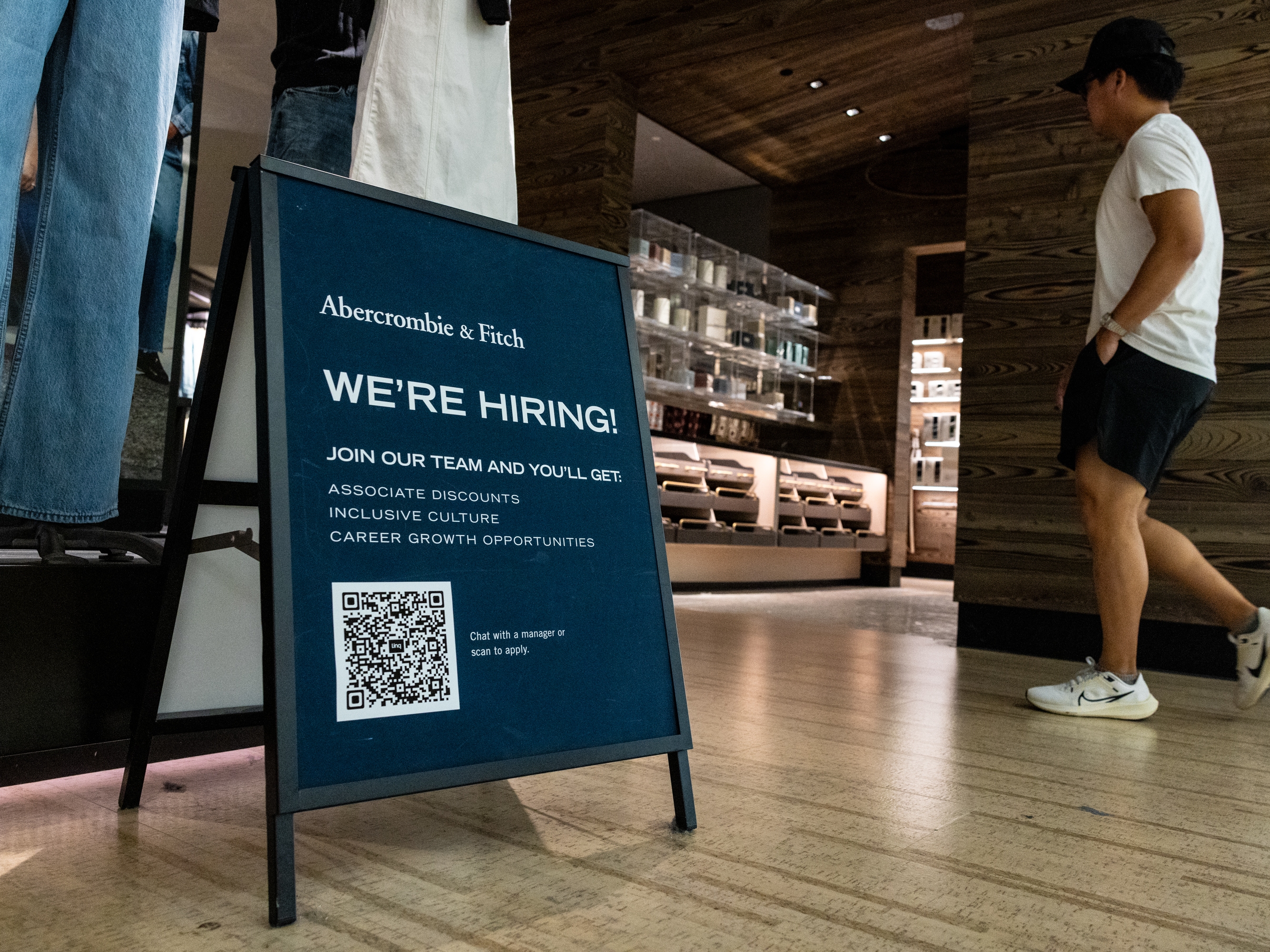 caption: U.S. employers added 254,000 jobs in September — more than forecasters had expected. Gains for July and August were also revised upward.