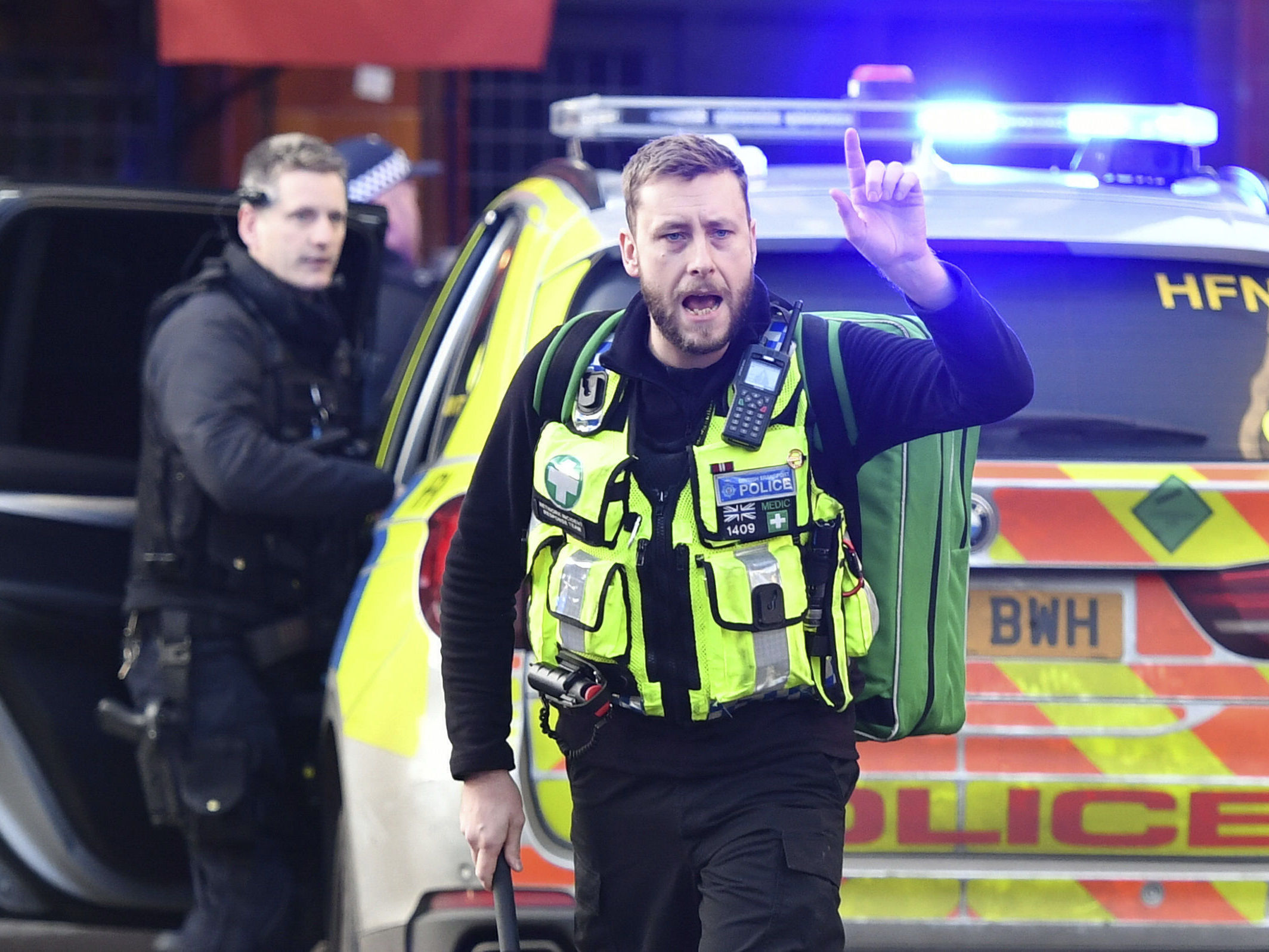 caption: Police and emergency services at the scene of an incident on London Bridge in central London following a police incident, on Friday.