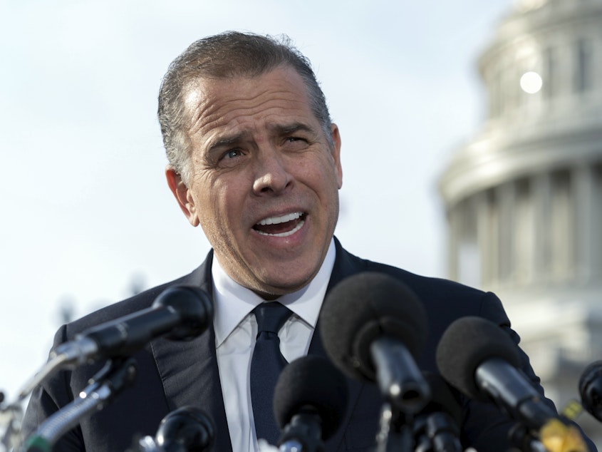 caption: Hunter Biden, son of President Biden, talks to reporters at the U.S. Capitol, in Washington, on Dec. 13, 2023. An FBI informant has been charged with lying to his handler about ties between Joe Biden and Hunter Biden and a Ukrainian energy company.