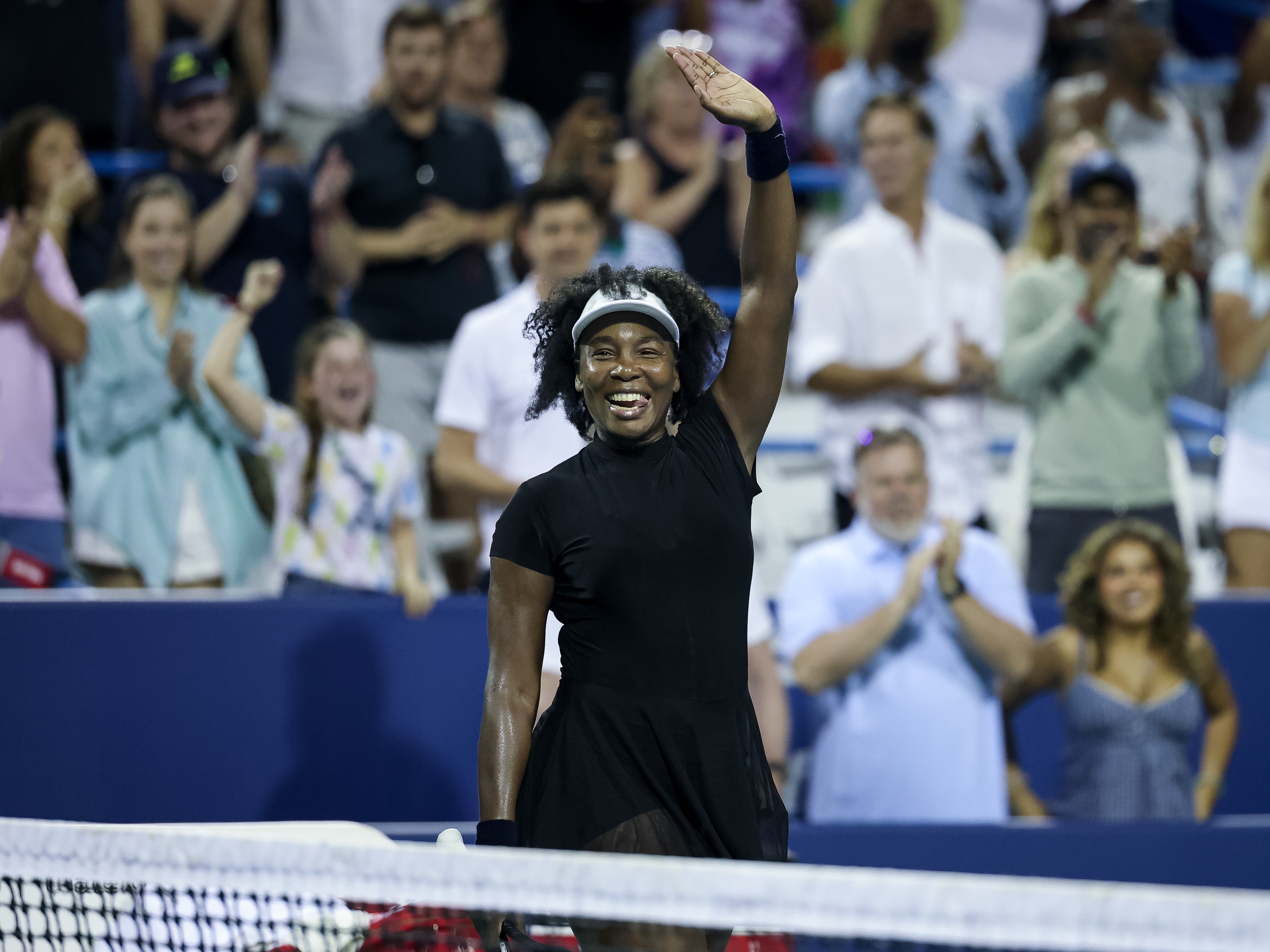 caption: Venus Williams celebrates after winning a women's single match against Peyton Stearns during on day 2 of the Mubadala Citi DC Open on July 22 in Washington, DC.
