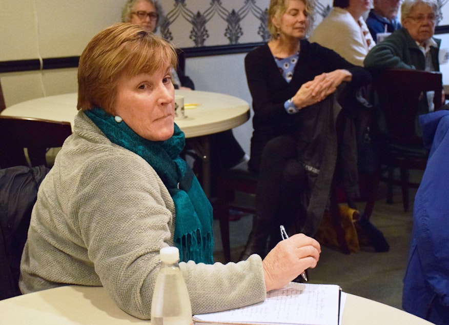 caption: Johna Thomson attends a meeting hosted by KUOW to talk about the development that is coming to Black Diamond, Washington.