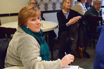 caption: Johna Thomson attends a meeting hosted by KUOW to talk about the development that is coming to Black Diamond, Washington.