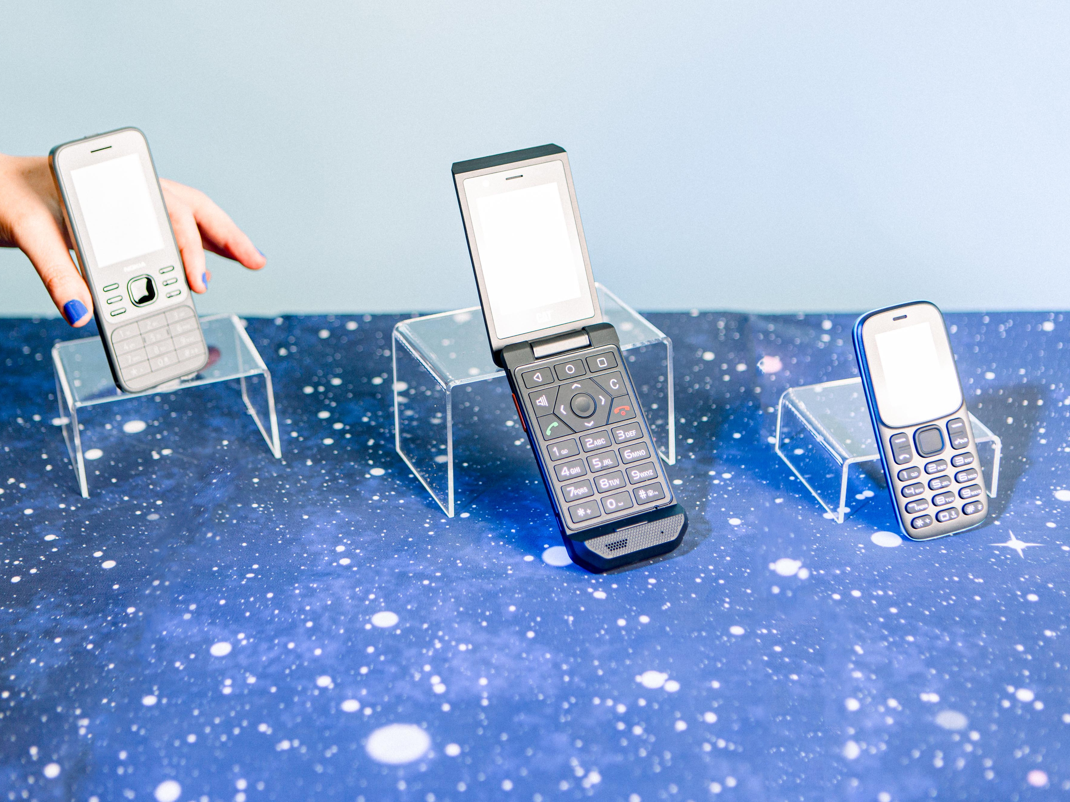 caption: Opting for a basic phone can help you take control of your time. There are many different models with different capabilities and price points. The three pictured here are the Nokia 6300 4G, the CAT S22 Flip and the BLU Z5 -GSM.