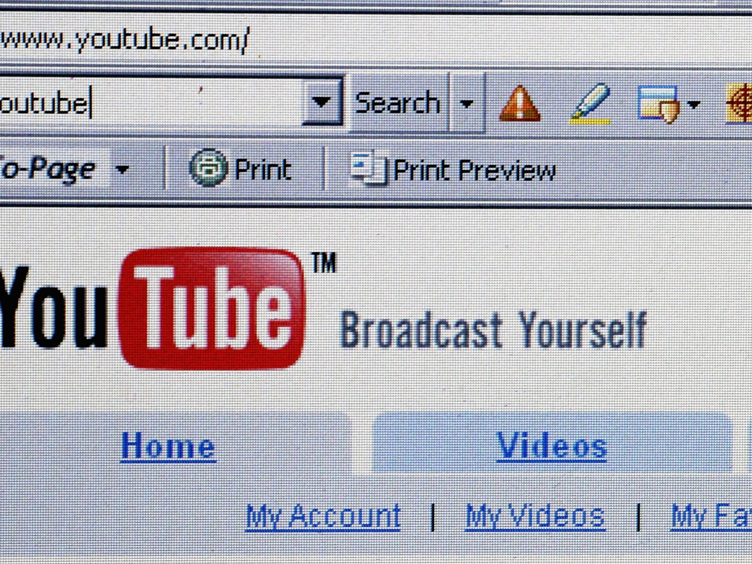 caption: In this photo illustration, the YouTube website is displayed on October 10, 2006, following Google's $1.65 billion acquisition of the platform.