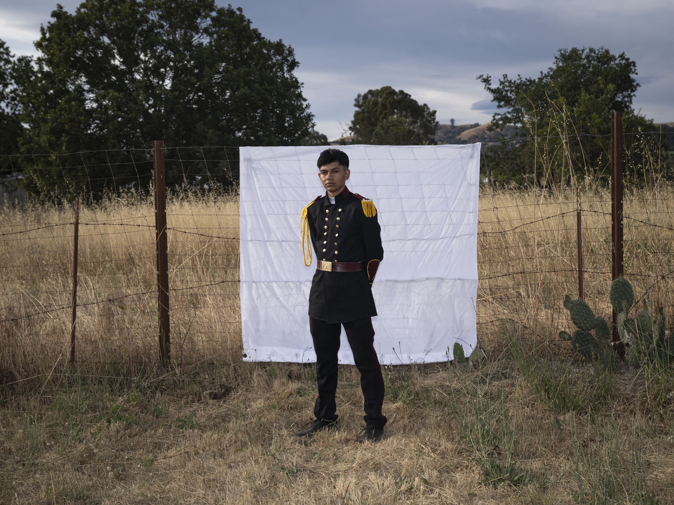 caption: Kevin rides a horse as he leads it to the middle of the rodeo to pose for a picture with his maids of honor at his birthday celebration. He's asked to be identified only by his first name to protect his safety.