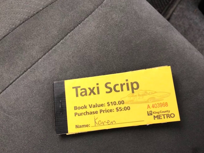 caption: Taxi Scrip, which subsidizes reduced fares for low income, disabled and elderly King County residents, is one example of the kind of government program available to taxis but not to Uber and Lyft. 