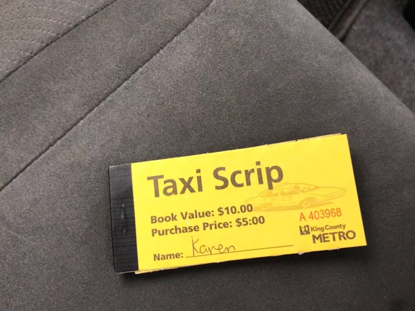 caption: Taxi Scrip, which subsidizes reduced fares for low income, disabled and elderly King County residents, is one example of the kind of government program available to taxis but not to Uber and Lyft.