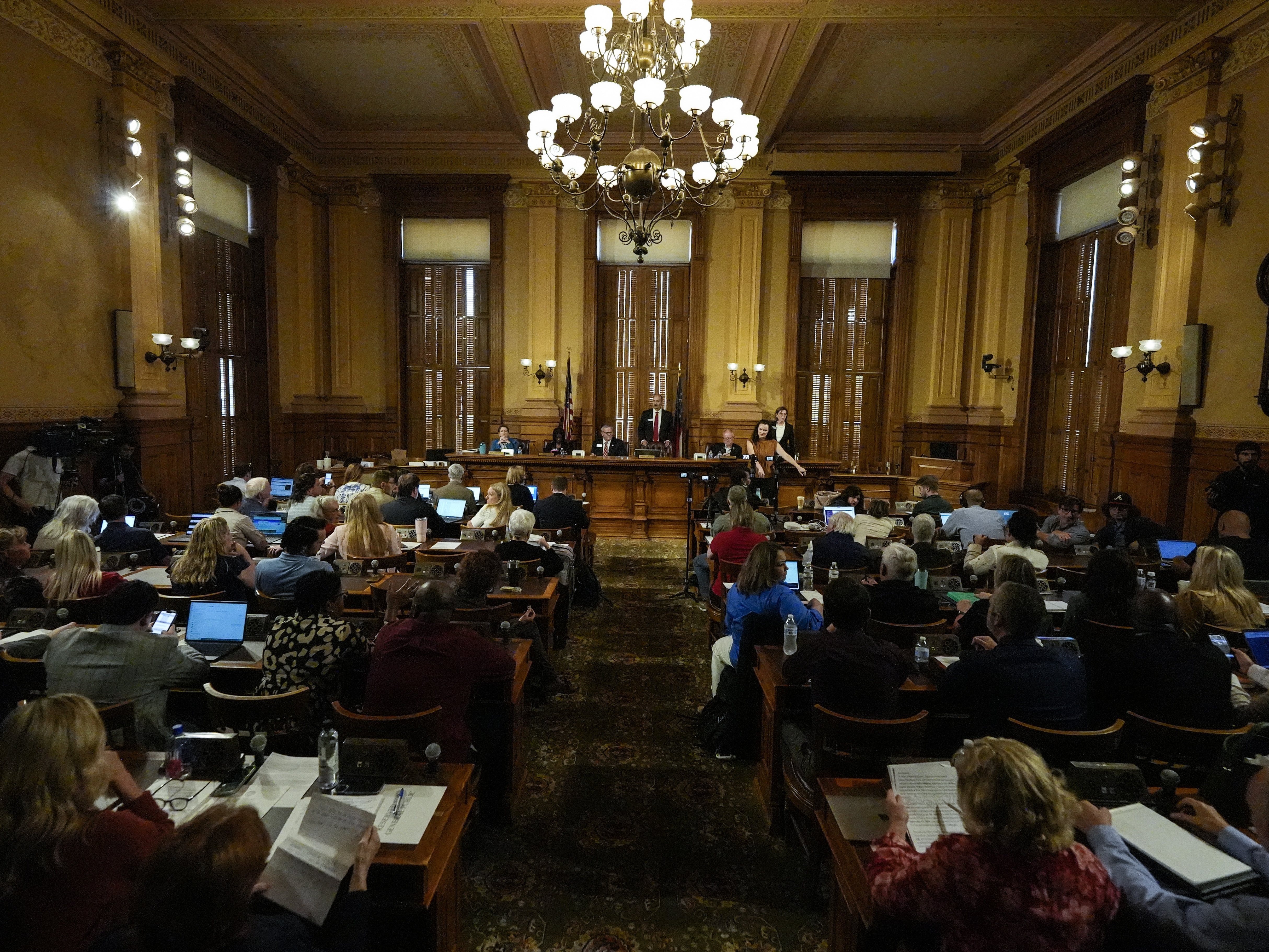 caption: Georgia's State Election Board members discuss proposals for election rule changes on Sept. 20 in Atlanta.