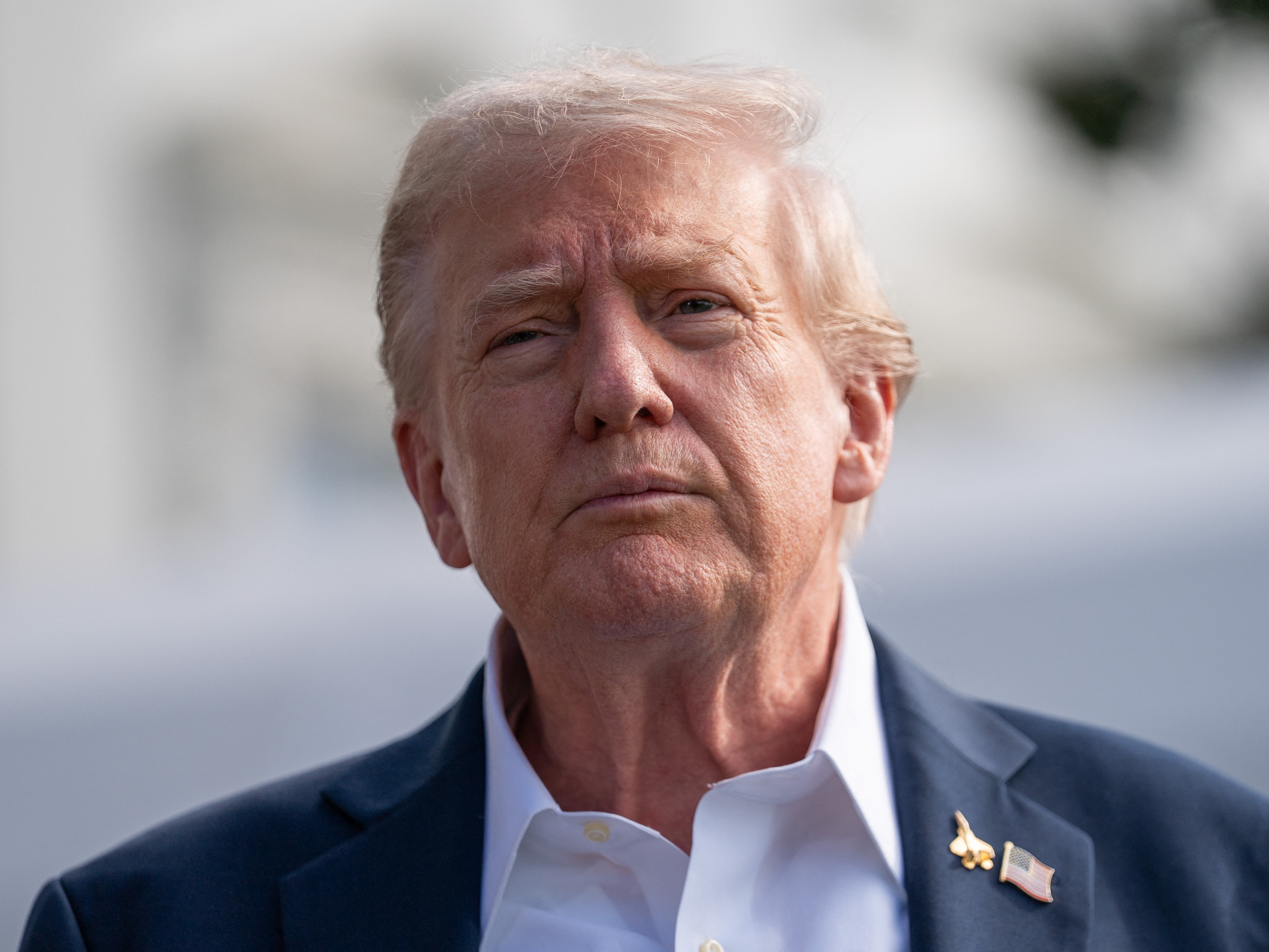 caption: President Trump speaks to the press from the South Lawn of the White House in Washington, D.C., on Sept. 26.