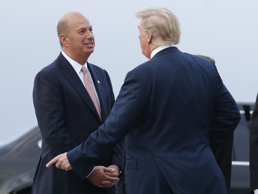 caption: U.S. Ambassador to European Union Gordon Sondland speaks with President Trump at Melsbroek Air Base in July 2018 in Brussels. Sondland is speaking to House committees on Thursday.