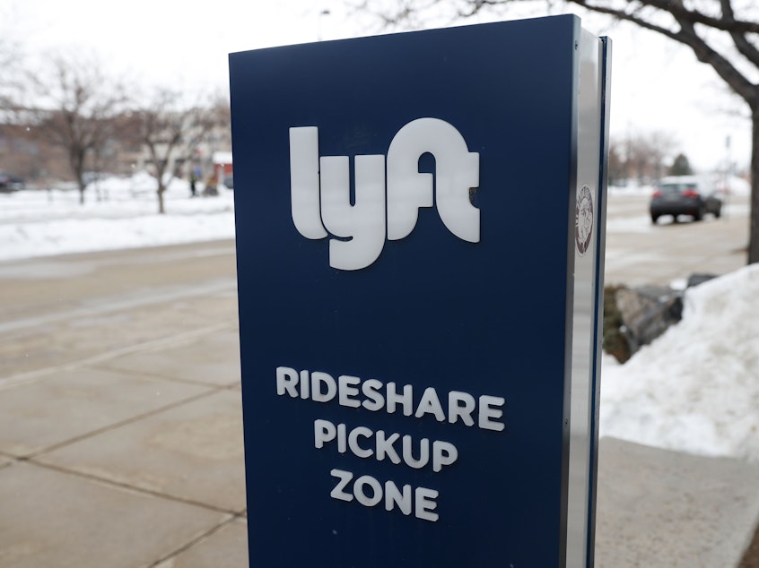 caption: Lyft and Uber's carpooling services let passengers share rides for cheaper fares.