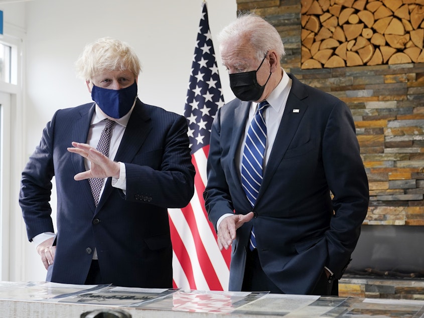 caption: President Biden and British Prime Minister Boris Johnson speak during a bilateral meeting ahead of the G-7 summit on Thursday in Carbis Bay, England.