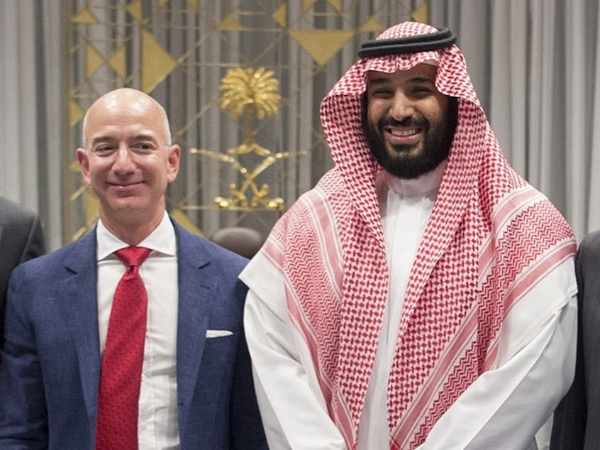 caption: The phone of Jeff Bezos (left) allegedly was hacked via a WhatsApp account held by by Saudi Crown Prince Mohammed bin Salman.