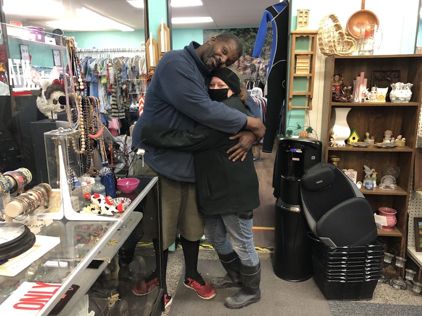 caption: Edward Myers and Ursula Wasmer in the Blessed Treasure thrift store in Belfair, Washington, a few days after Election Day 2020. The thrift store is in the only Puget Sound-area county that went for President Donald Trump as of Wednesday night. Washington state overall went for Joe Biden.