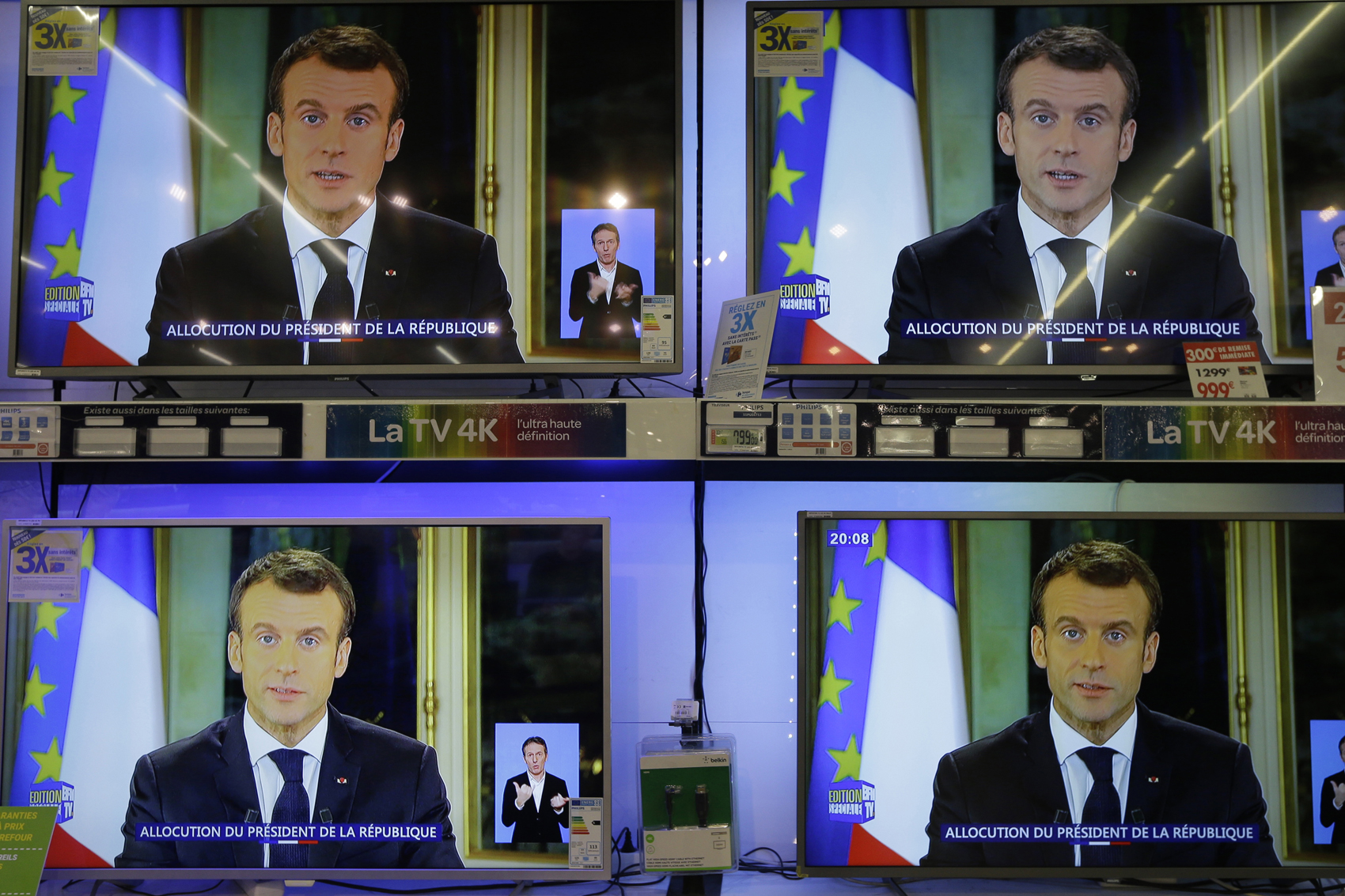 caption: TV screens show French President Emmanuel during a televised address to the nation, at an electrical appliance store in Marseille, southern France, Monday, Dec. 10, 2018. President Emmanuel Macron has acknowledged he's partially responsible for the anger that has fueled weeks of protests in France, an unusual admission for the leader elected last year. (Claude Paris/AP)