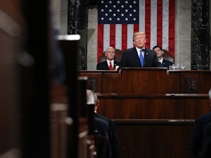 caption: President Trump delivers his first State of the Union address on Jan. 30, 2018, in the House Chamber of the U.S. Capitol. The White House is moving forward with plans for this year's speech on Jan. 29, but it's unclear whether House Speaker Nancy Pelosi will agree to it amid the partial government shutdown.