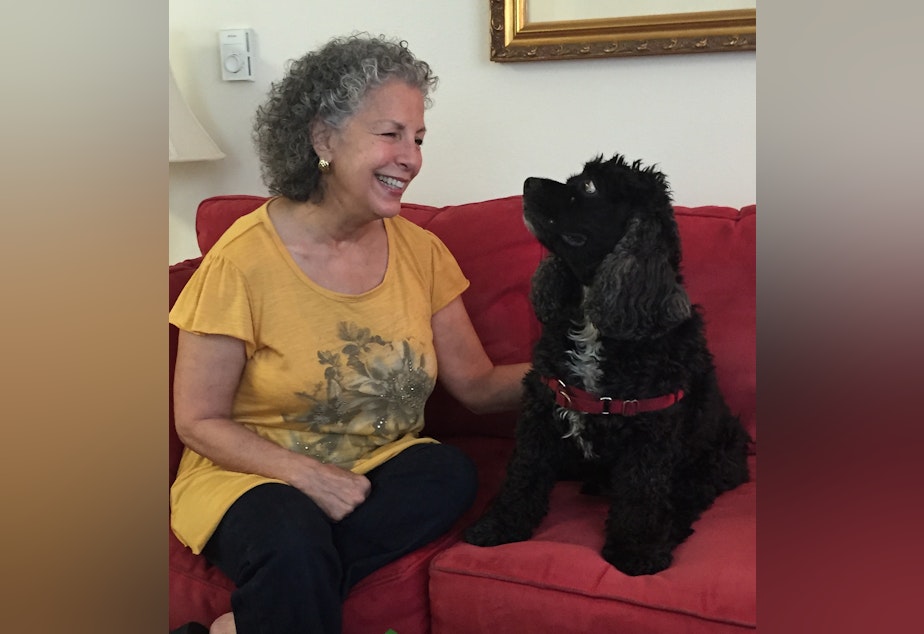 caption: Myriam Marquez at her apartment with her cocker spaniel, Joe Cocker. 