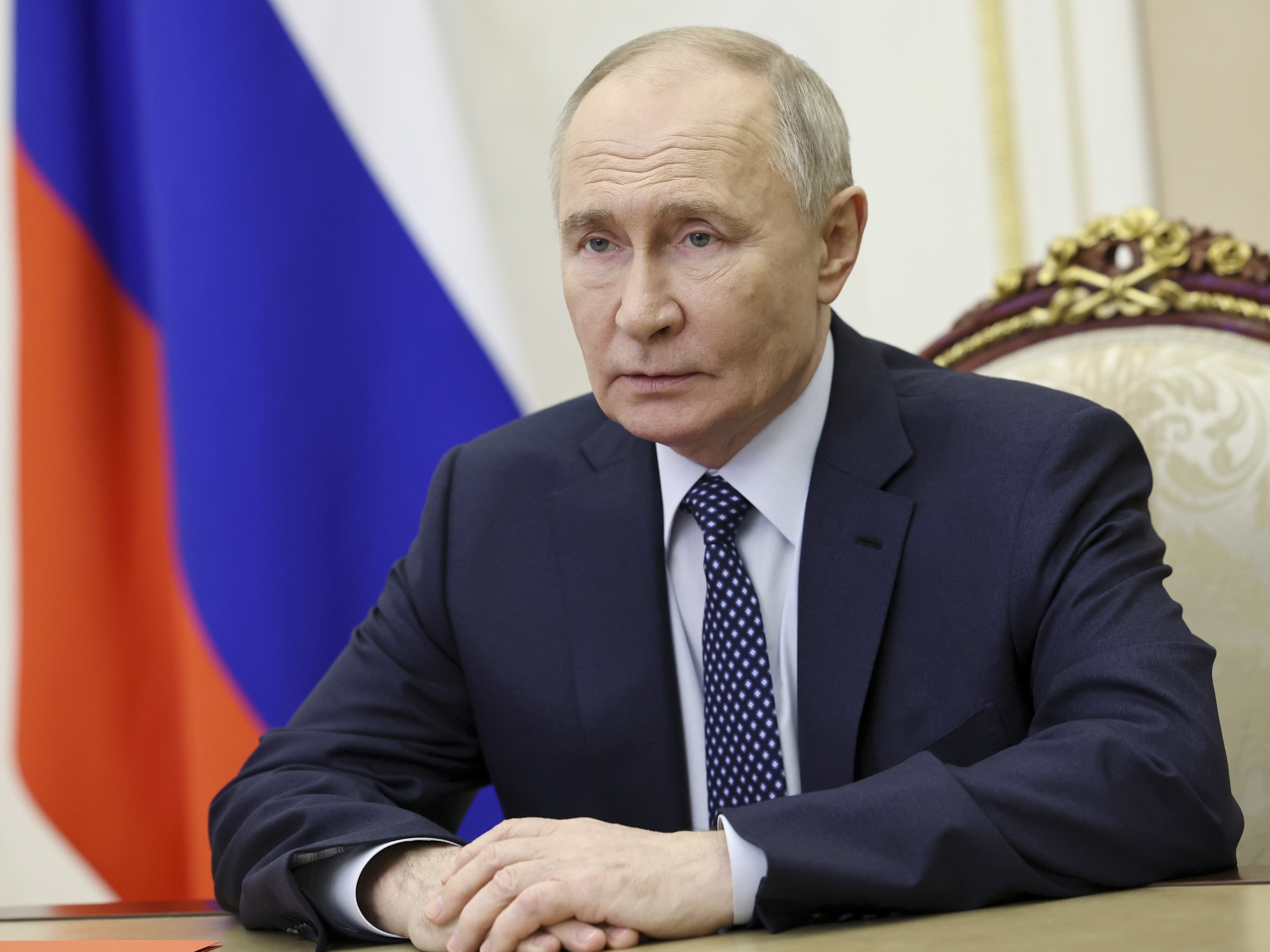 caption: Russian President Vladimir Putin chairs a Security Council meeting via videoconference at the Kremlin in Moscow, on Saturday.