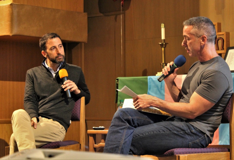 caption: Eli J. Finkel and Dan Savage at University Temple United Methodist Church