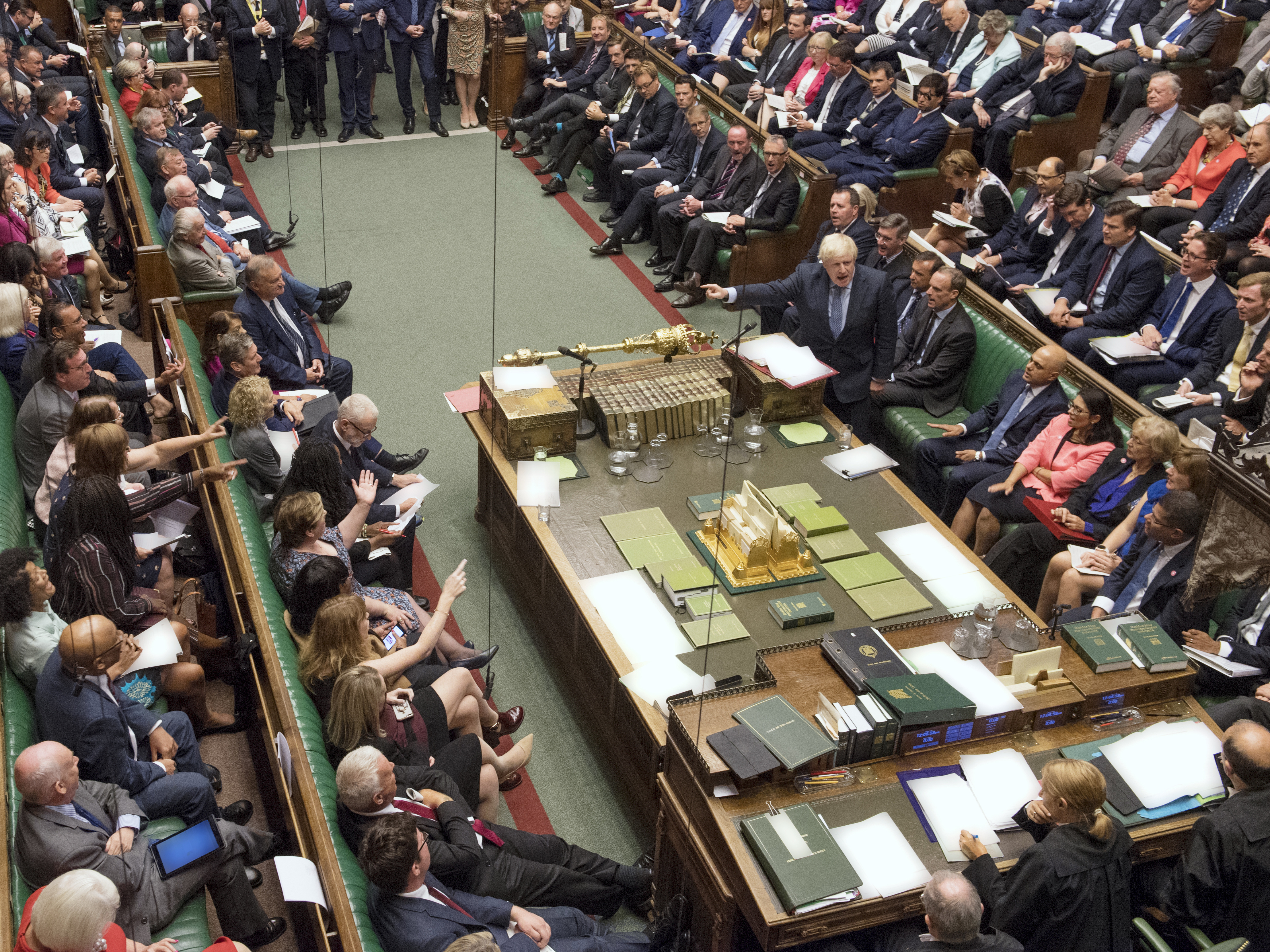 caption: Prime Minister Boris Johnson (center right) gestures during his first Prime Minister's Questions in London Wednesday. The U.K.'s House of Commons voted to block a no-deal Brexit, prompting Johnson to call for a general election next month — which was also voted down.