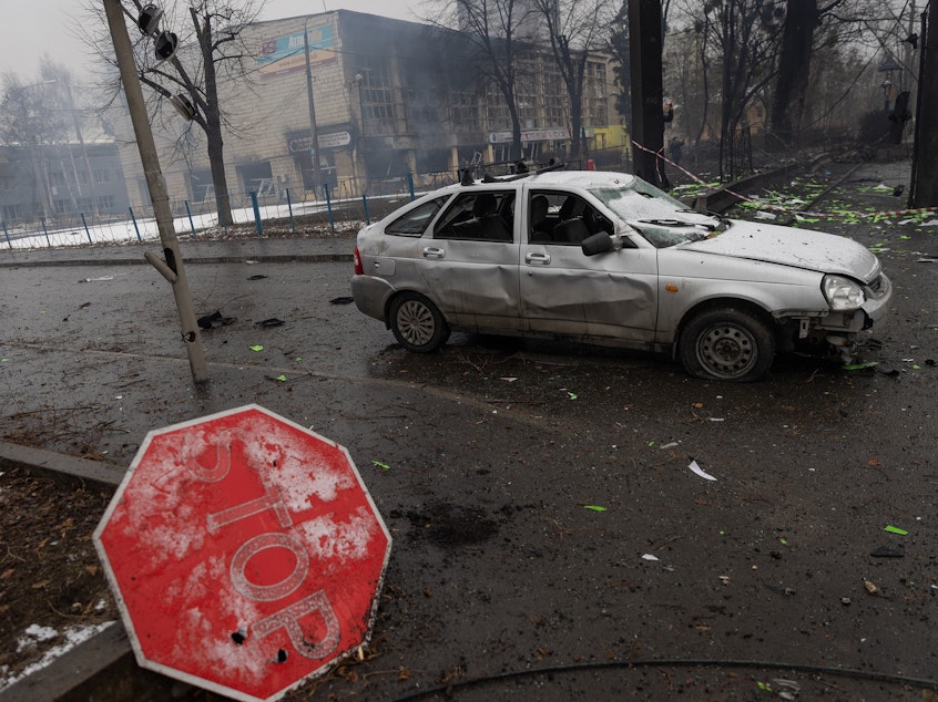 caption: Rubble and a damaged vehicle is seen across the street from the Kyiv TV Tower on Wednesday.