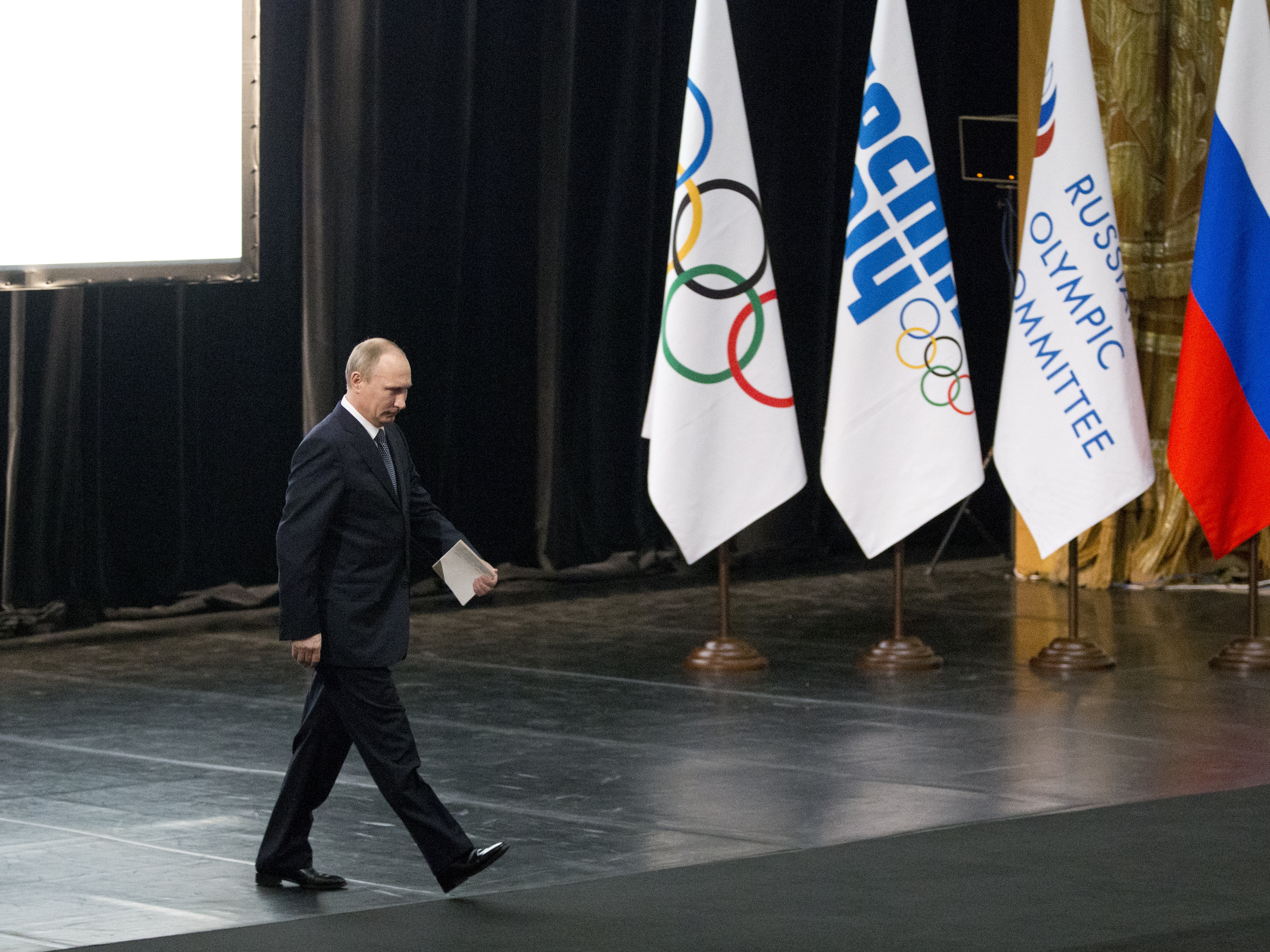 caption: Russian President Vladimir Putin was once a major player in the Olympic movement, spending tens of billions of dollars to host the Sochi Winter Games in 2014. Now his nation is barely participating in this year's Paris Summer Games.