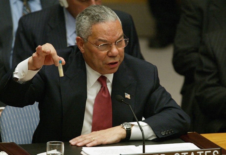 caption: Then-U.S. Secretary of State Colin Powell holds up a vial that he said was the size that could be used to hold anthrax as he addresses the United Nations Security Council in February 2003 at the U.N. in New York.
