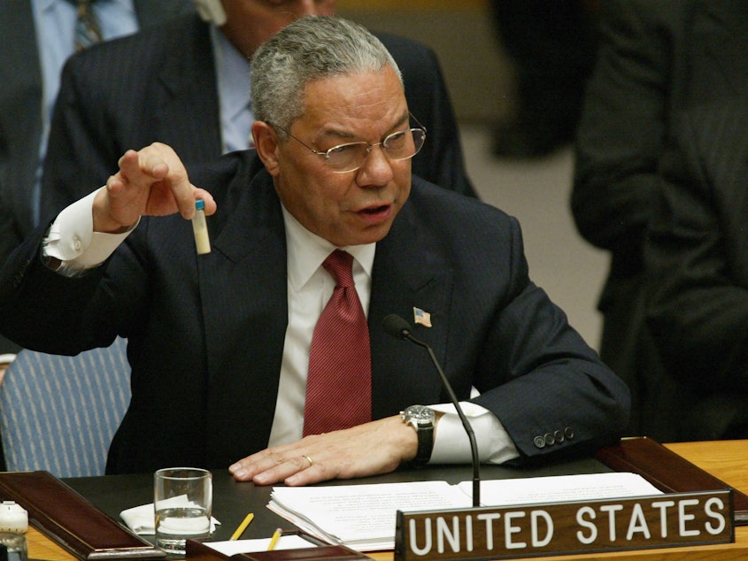 caption: Then-U.S. Secretary of State Colin Powell holds up a vial that he said was the size that could be used to hold anthrax as he addresses the United Nations Security Council in February 2003 at the U.N. in New York.