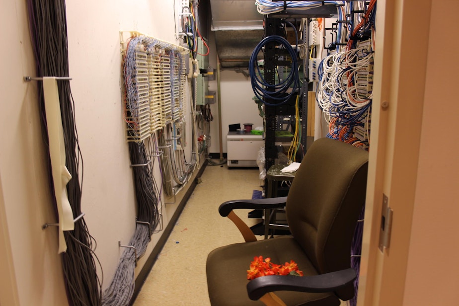 caption: KUOW's old lactation room was an electrical closet Moms hung that orange lei on the door to let station engineers know they were pumping.