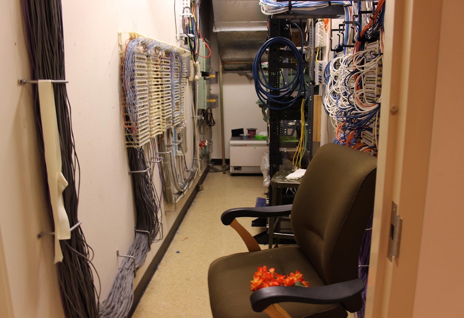 caption: KUOW's old lactation room was an electrical closet Moms hung that orange lei on the door to let station engineers know they were pumping.