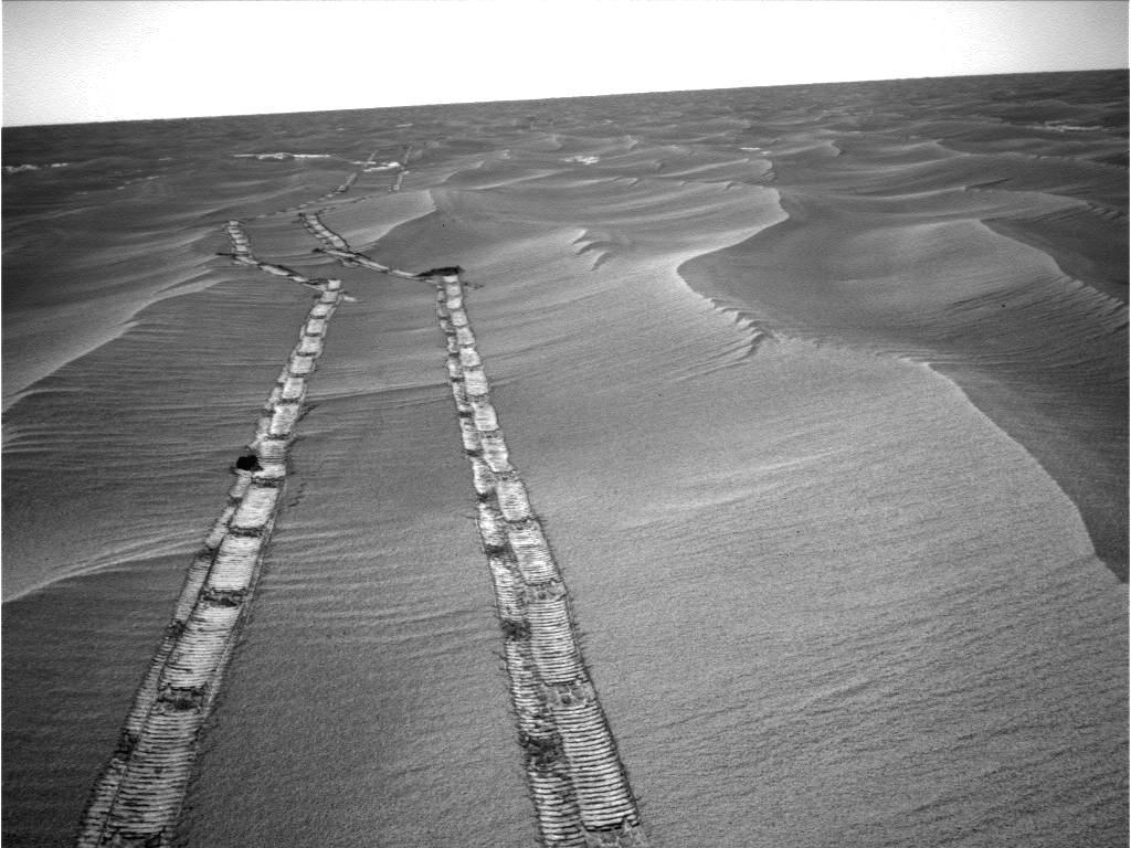 caption: NASA's Opportunity rover used its navigation camera to capture this northward view of tracks in May 2010 during its long trek to Mars' Endeavour crater.