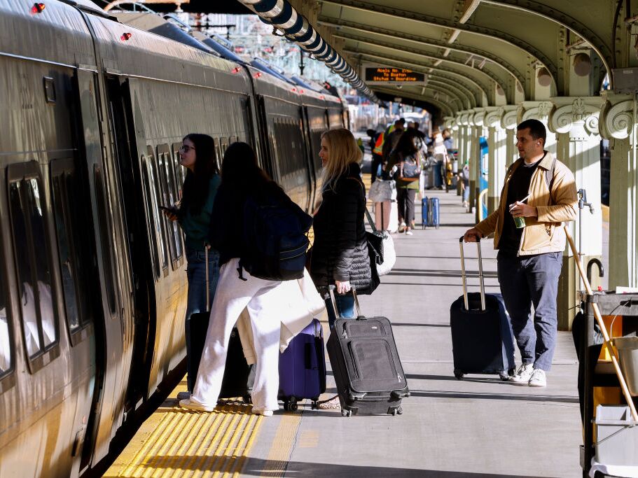 caption: Travelers board an Acela train at Union Station in Washington, D.C. in November, 2024. Amtrak reported a 5% increase in ridership in March compared to the year before.