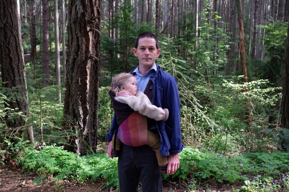 caption: Physician John Okrent and his 16-month-old daughter.