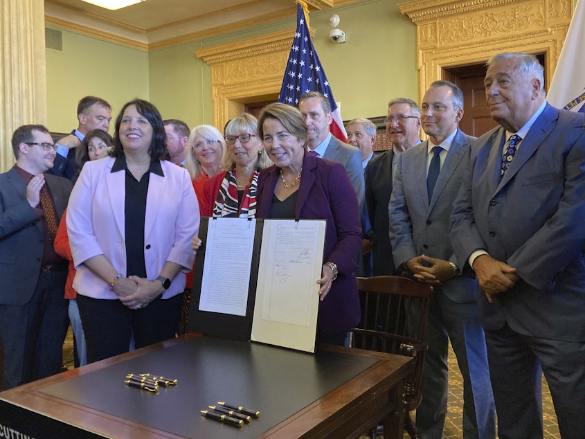 caption: Massachusetts Gov. Maura Healey signed a tax relief package on Oct. 4. Among other things, it expanded a child and family tax credit.