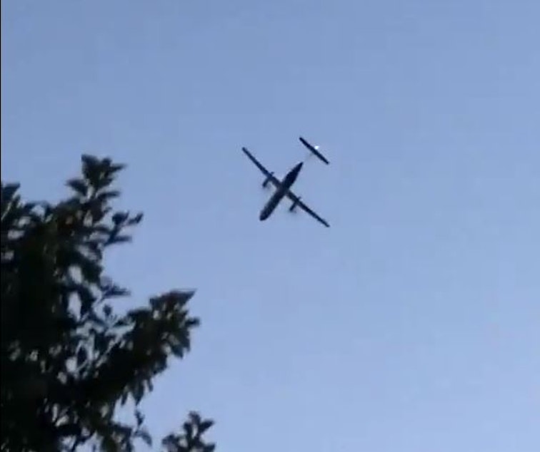 caption: A screenshot of the Bombardier Q400 turbojet before crashing from a video by Skylar Jacobson.