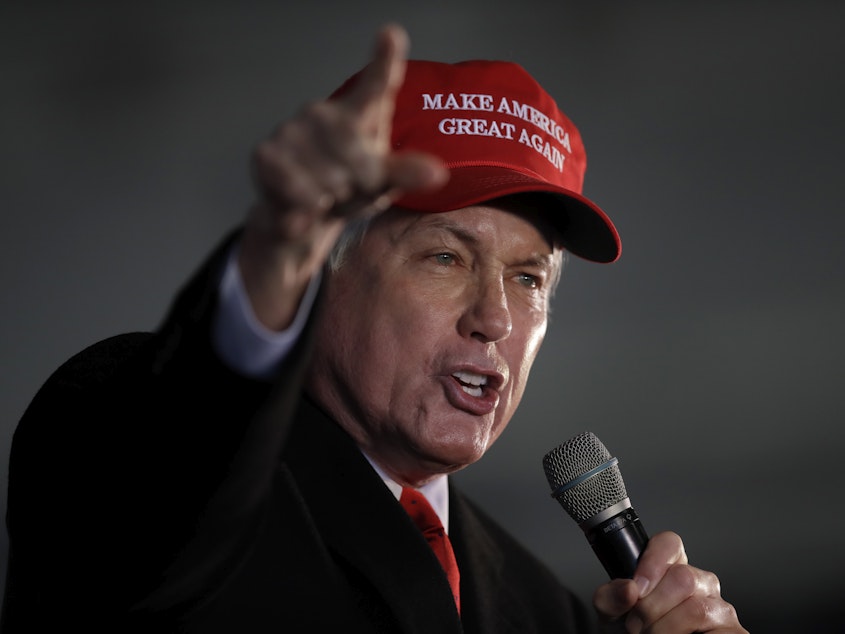 caption: Attorney Lin Wood speaks during a rally in Dec. 2020 in Alpharetta, Ga.