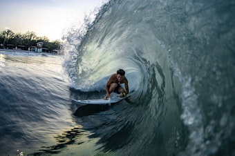 caption: Ben Elliott gets barreled at the BSR Surf Resort, where artificial waves are attracting world-class talent.