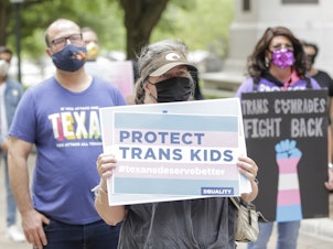 caption: Protesters rally at the Texas State Capitol on May 4, 2021 in Austin to stop proposed medical care ban legislation that would criminalize gender-affirming care.
