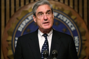 caption: WASHINGTON - JUNE 25: FBI Director Robert Mueller speaks during a news conference at the FBI headquarters June 25, 2008 in Washington, DC. The news conference was to mark the 5th anniversary of Innocence Lost initiative. (Photo by Alex Wong/Getty Images)